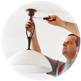 Electrician Installing a Light Fixture